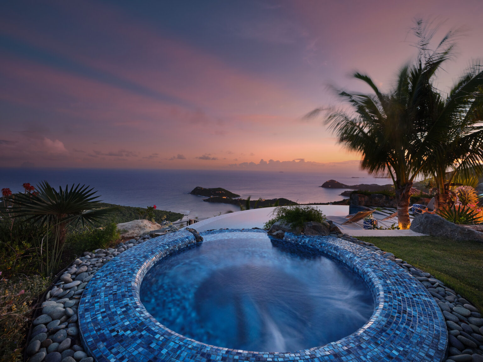 Glass tile spa with underwater lighting at sunset overlooking the sea, private estate St. John USVI, by Aquatics International Group